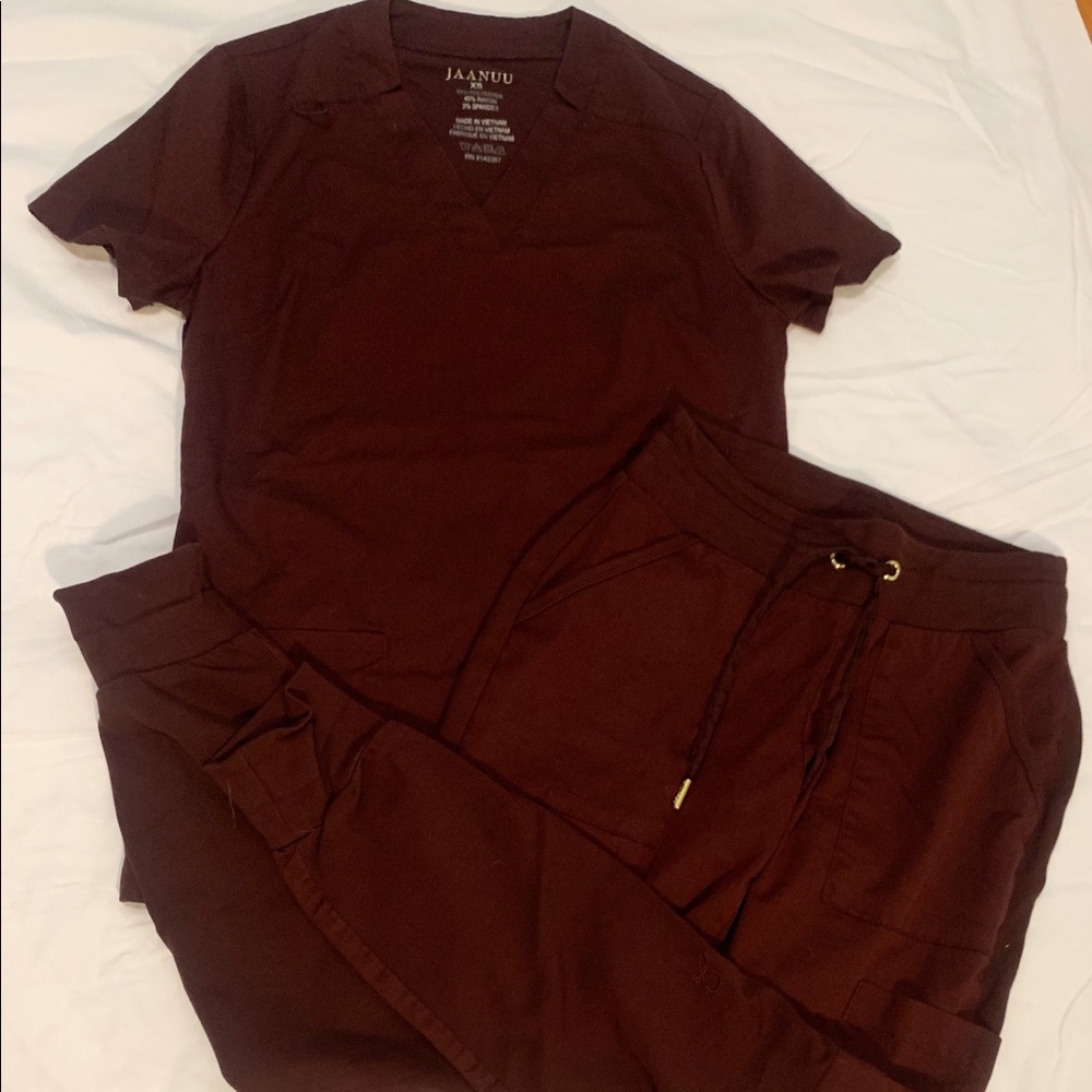 Jaanuu burgundy scrub jogger set.